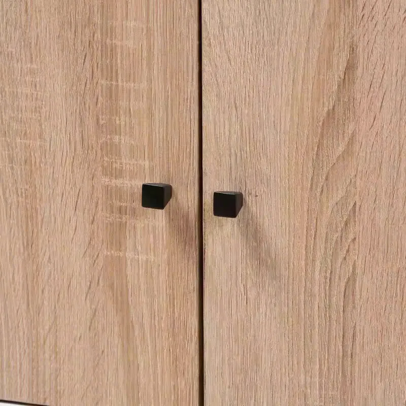 Kệ tivi gỗ MDF 3 cánh cửa mở, chân cao, thiết kế tối giản, đặt trên nền sàn gỗ, phù hợp phòng khách hiện đại.